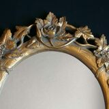 Miroir doré en résine à décor floral