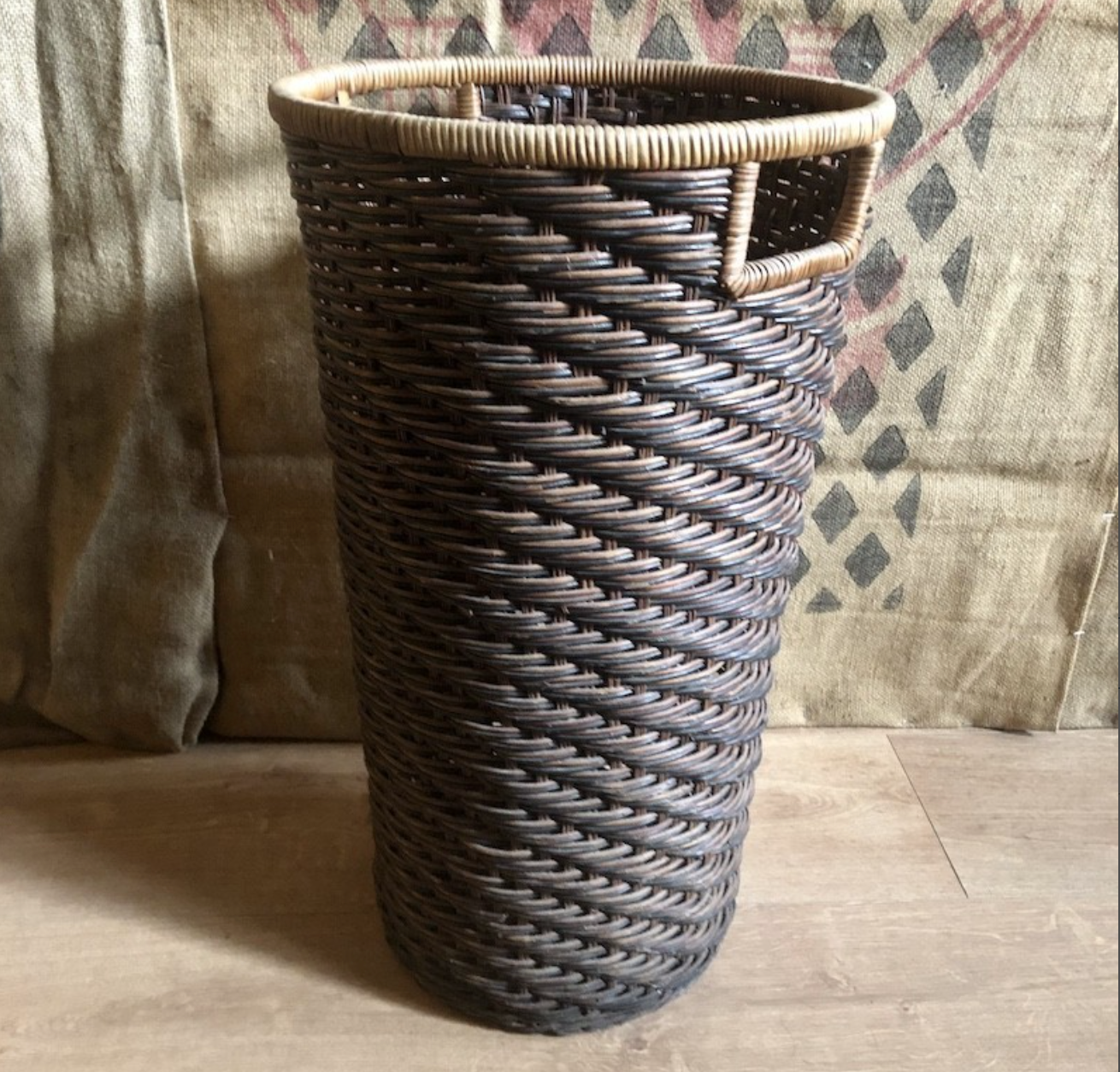 High basket in braided wicker