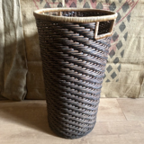 High basket in braided wicker