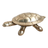 Empty brass turtle pocket