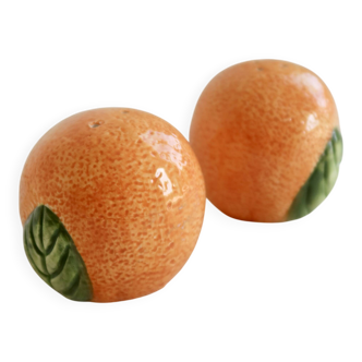 Vintage salt and pepper shaker in the shape of an orange.