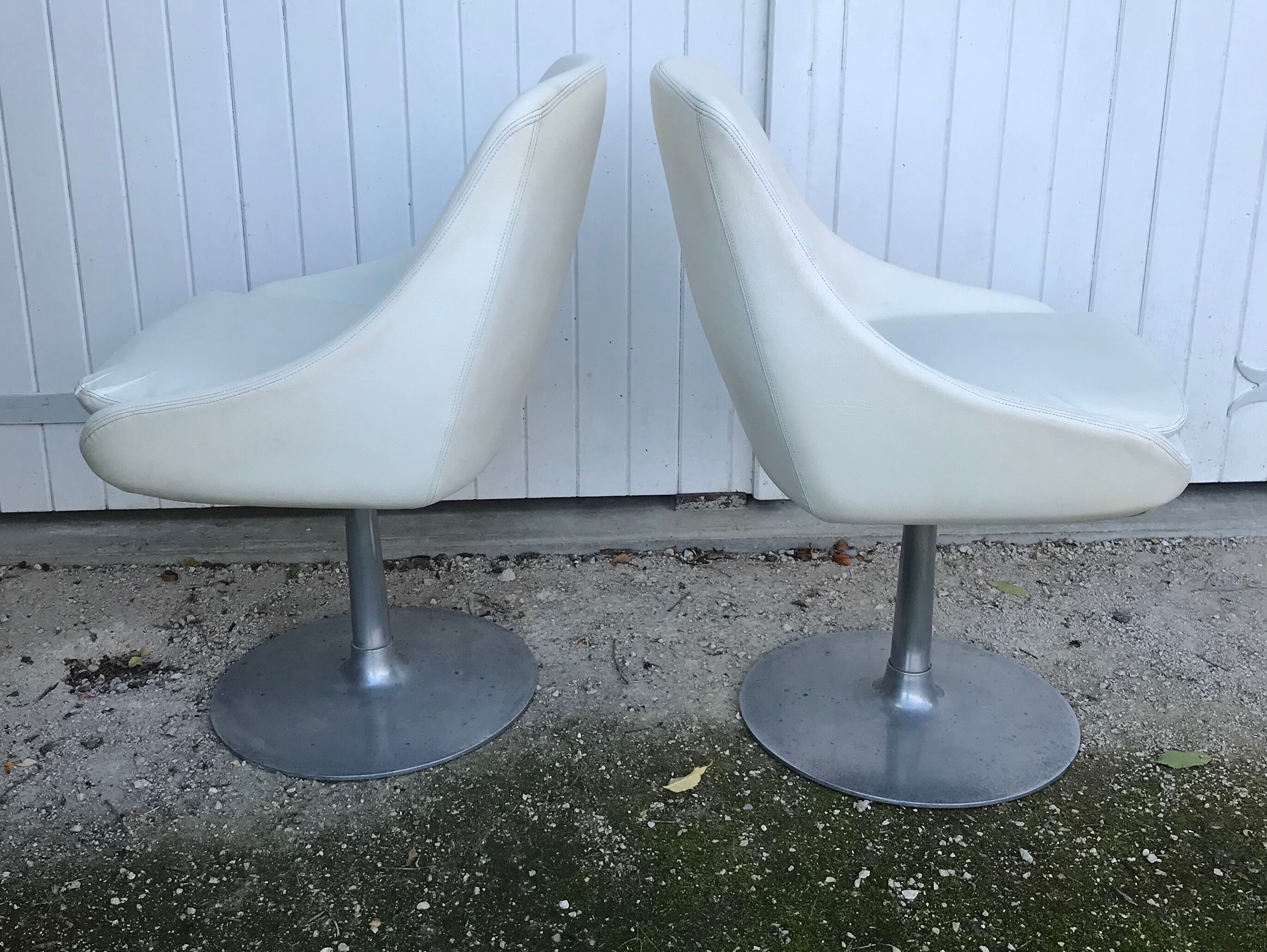 Pair of vintage armchairs with swivel tulip feet