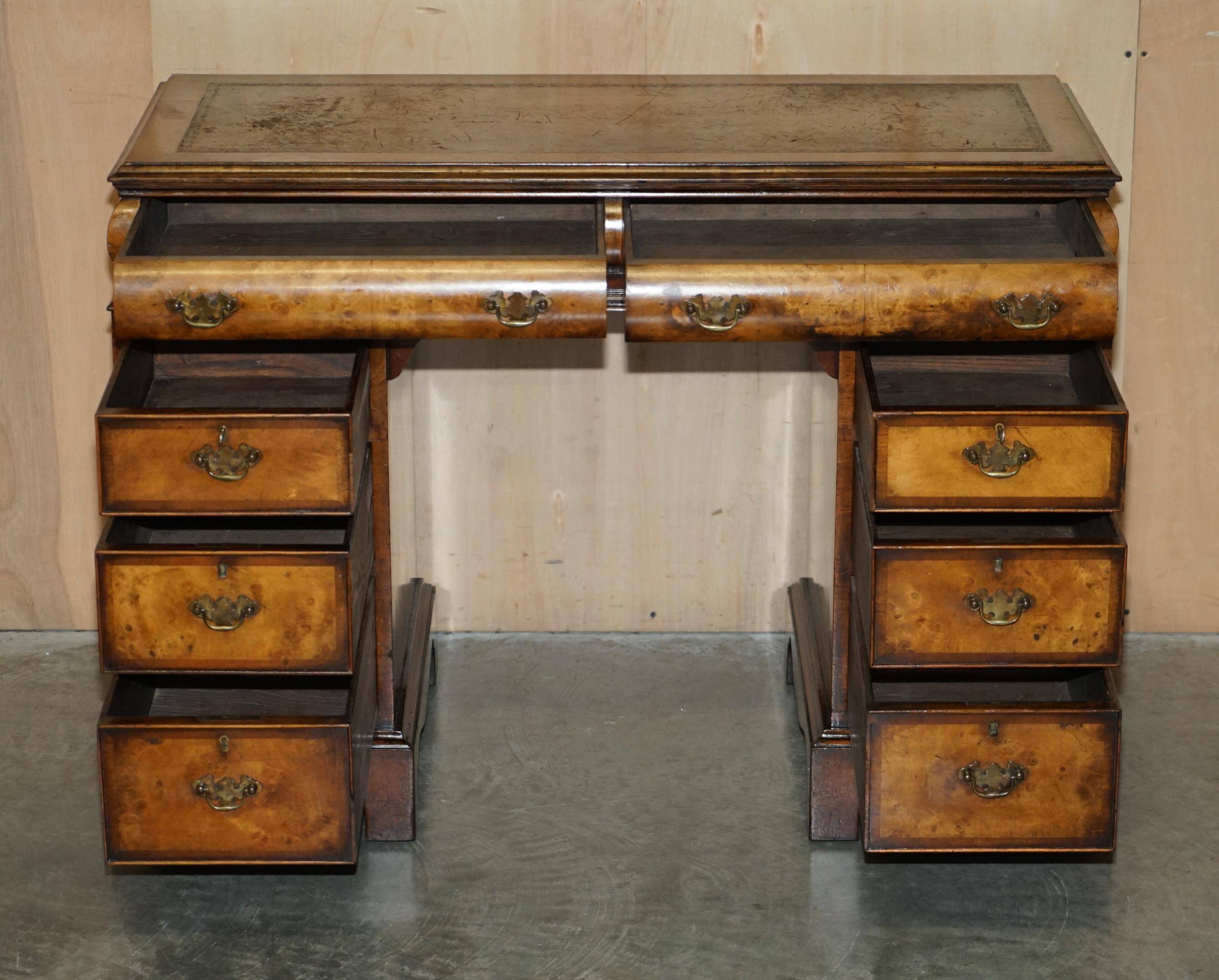 Victorian antique partner's desk in veined walnut with a leather top.