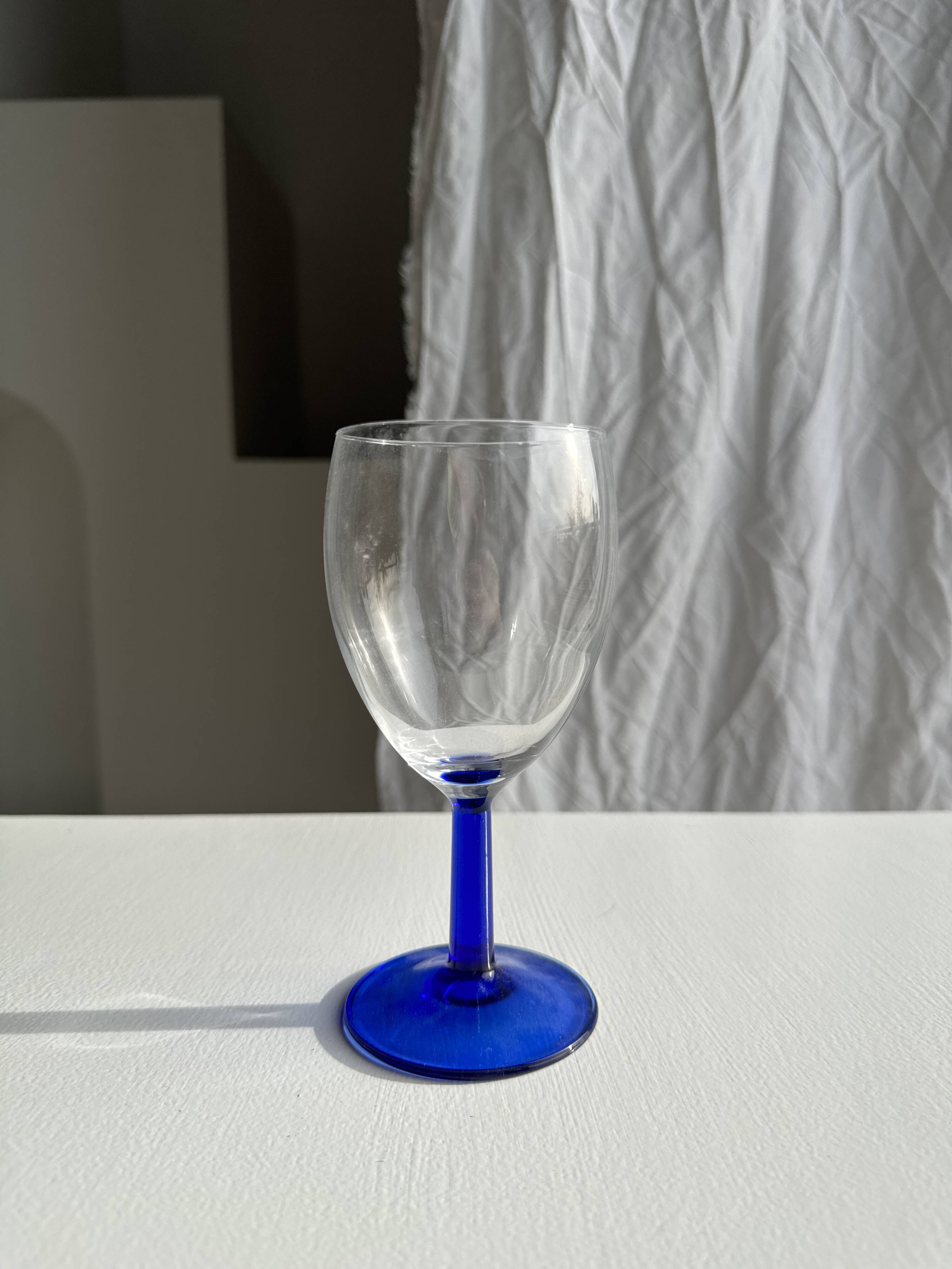 Set of 3 large blue stemmed glasses and 3 small blue stemmed glasses
