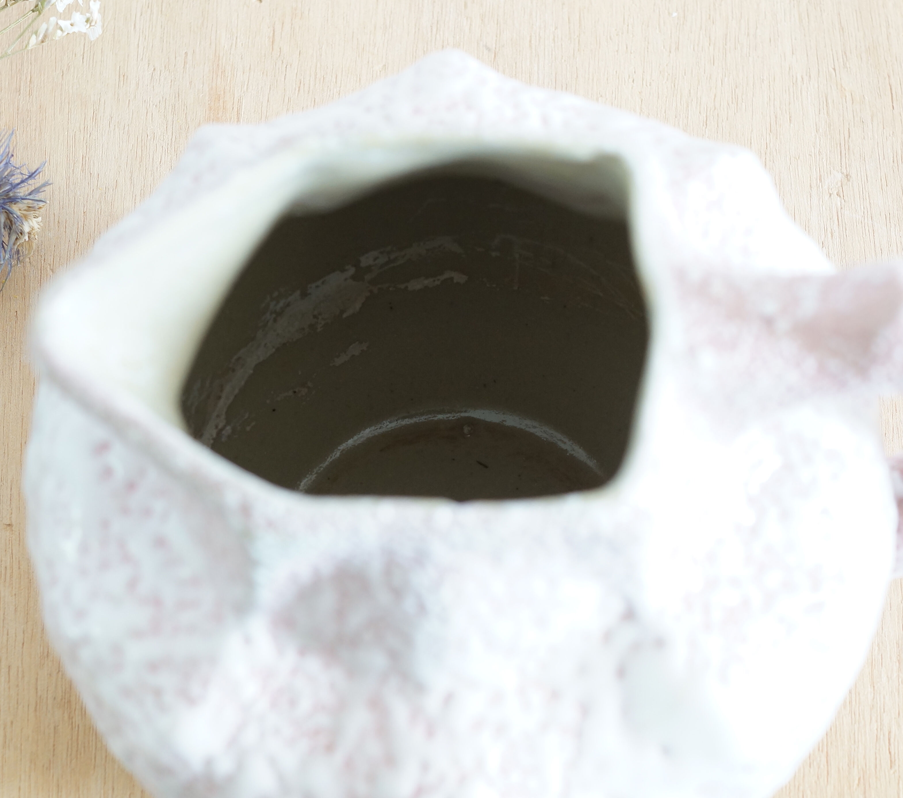 Art Nouveau ceramic pitcher with lava stone look