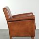 Sturdy vintage sheepskin armchair with a beautiful cognac colour