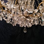 Chandelier in crystal and gilded bronze