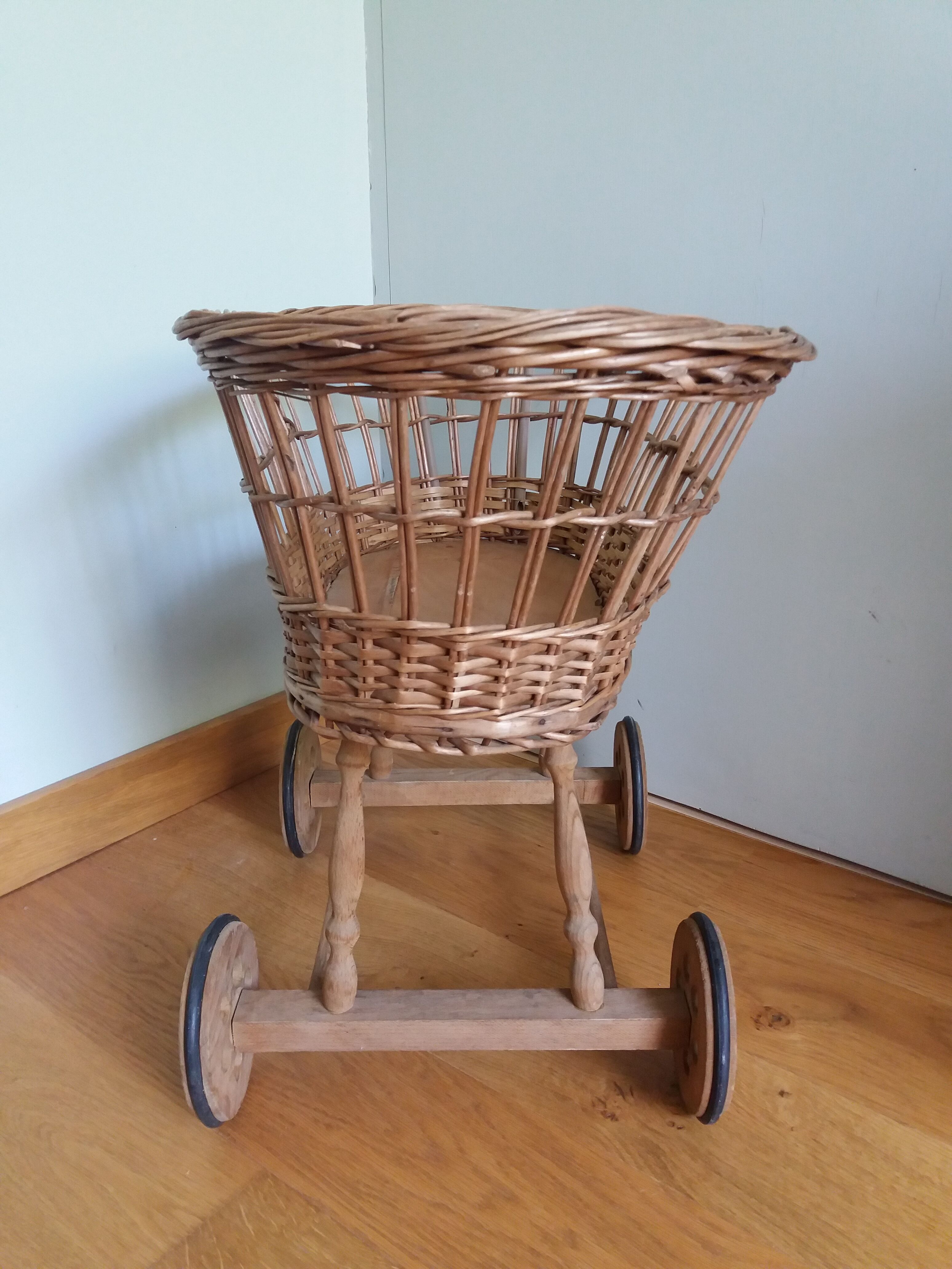 Wicker rattan doll cradle with wheels