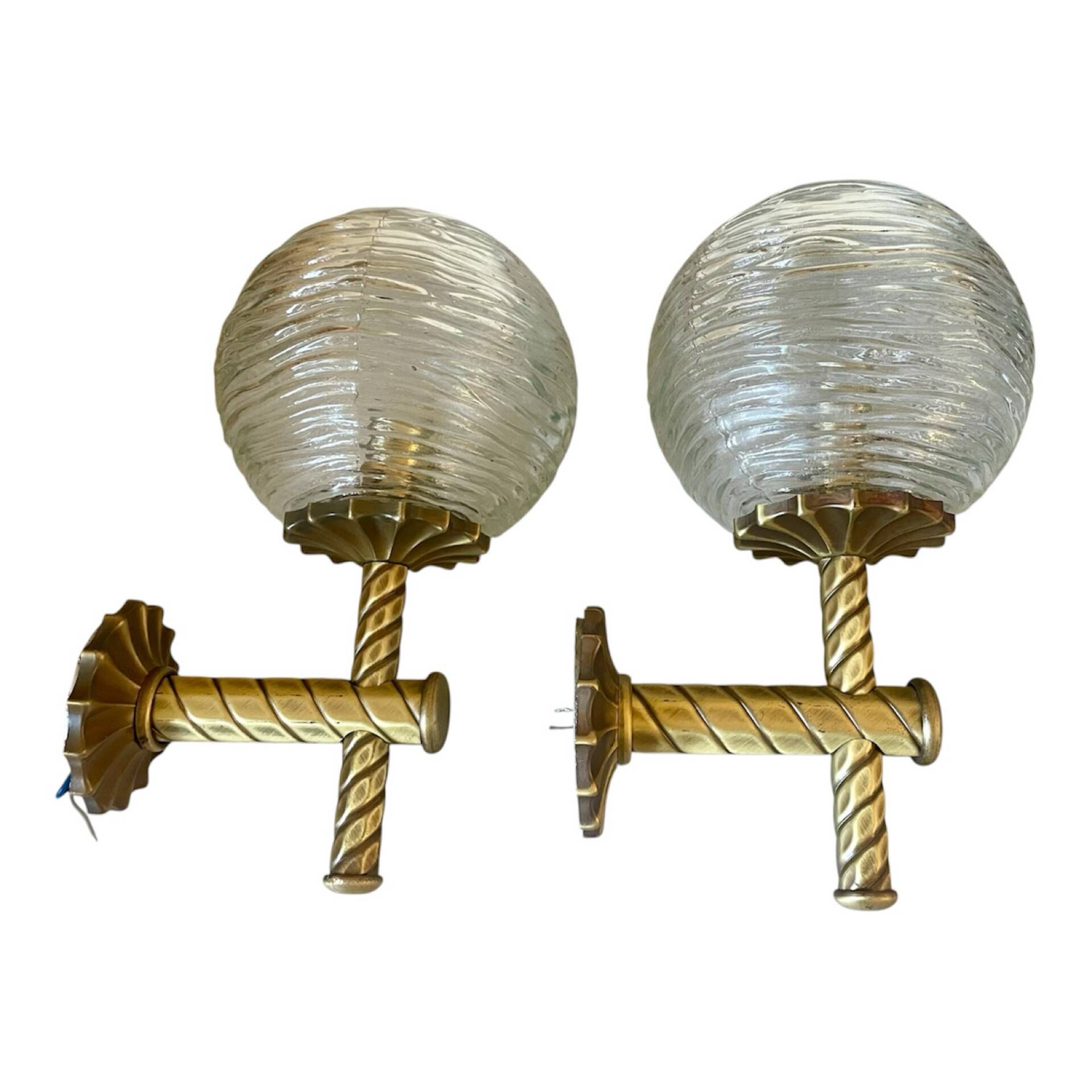 Pair of neoclassical wall sconces in twisted brass and ribbed glass.