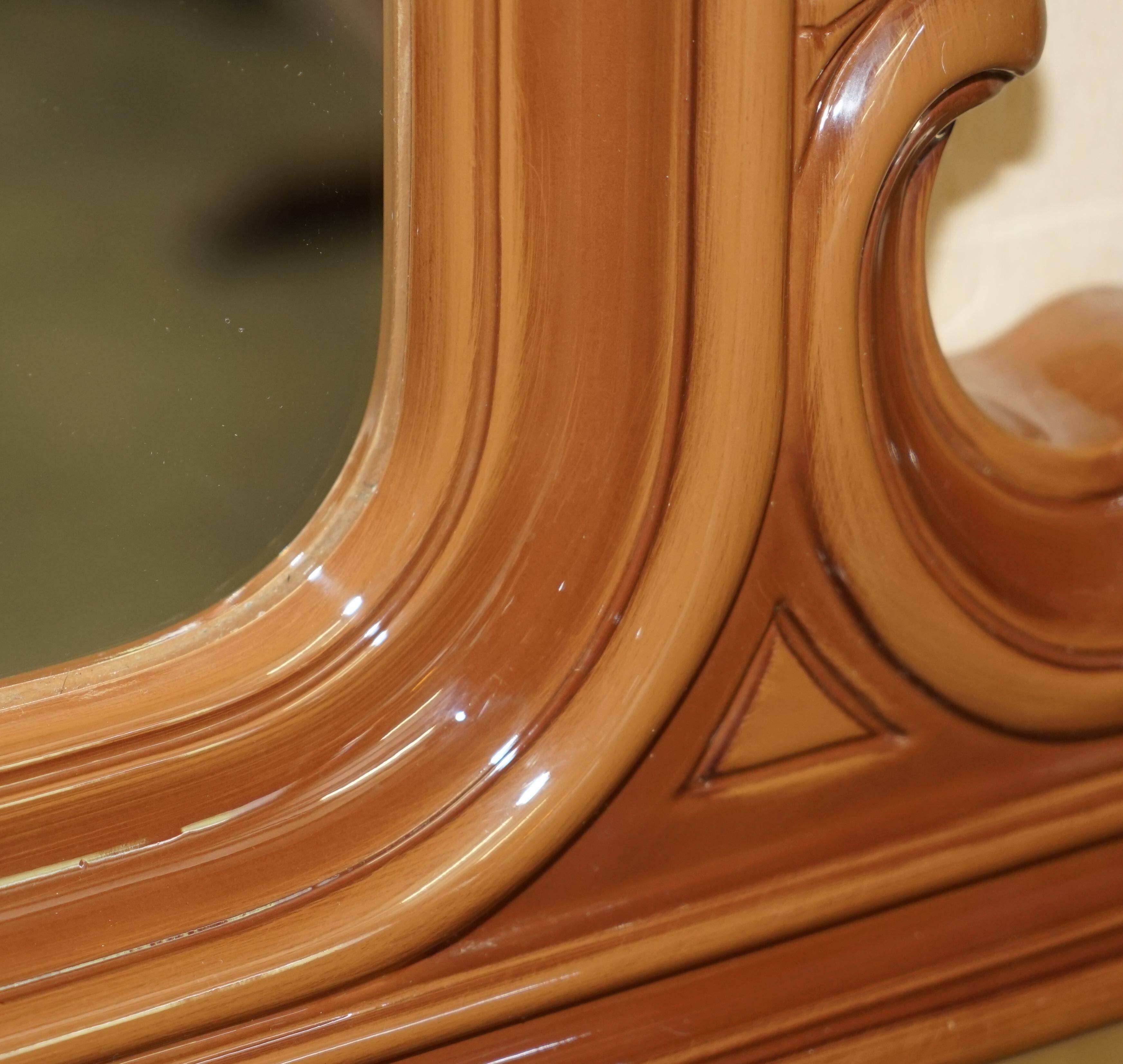 Vintage Art Deco decorative mirror with a thick frame.