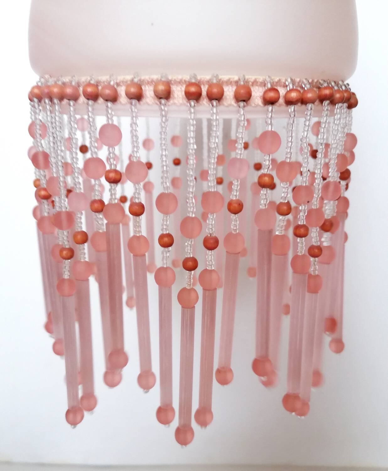 Pink glass wall lamp with garland of pearls