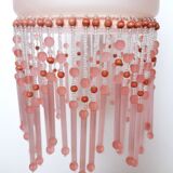 Pink glass wall lamp with garland of pearls