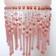 Pink glass wall lamp with garland of pearls