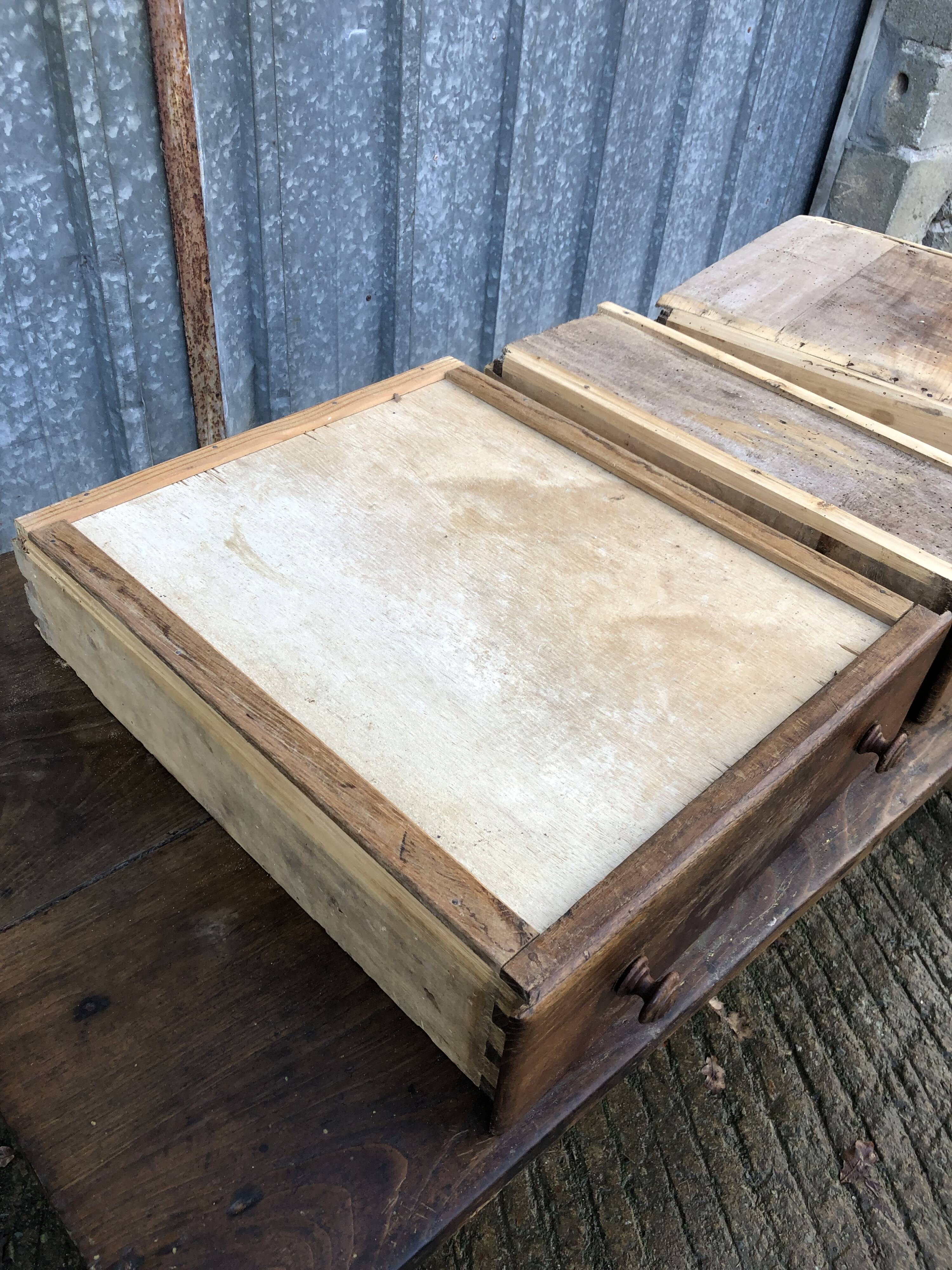 Old chestnut table with 3 front drawers and a cat bar.