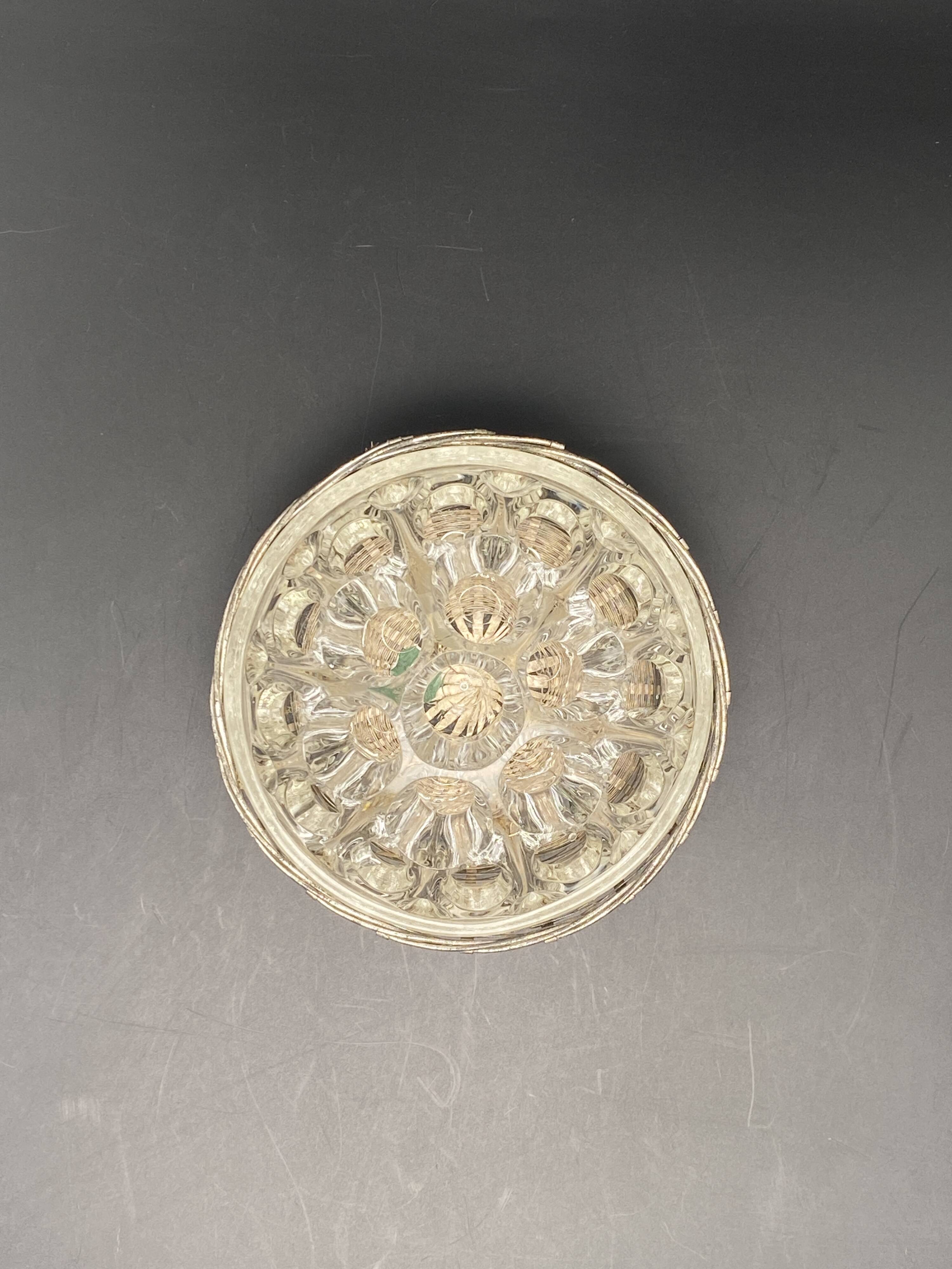 Glass flower stand with woven metal support