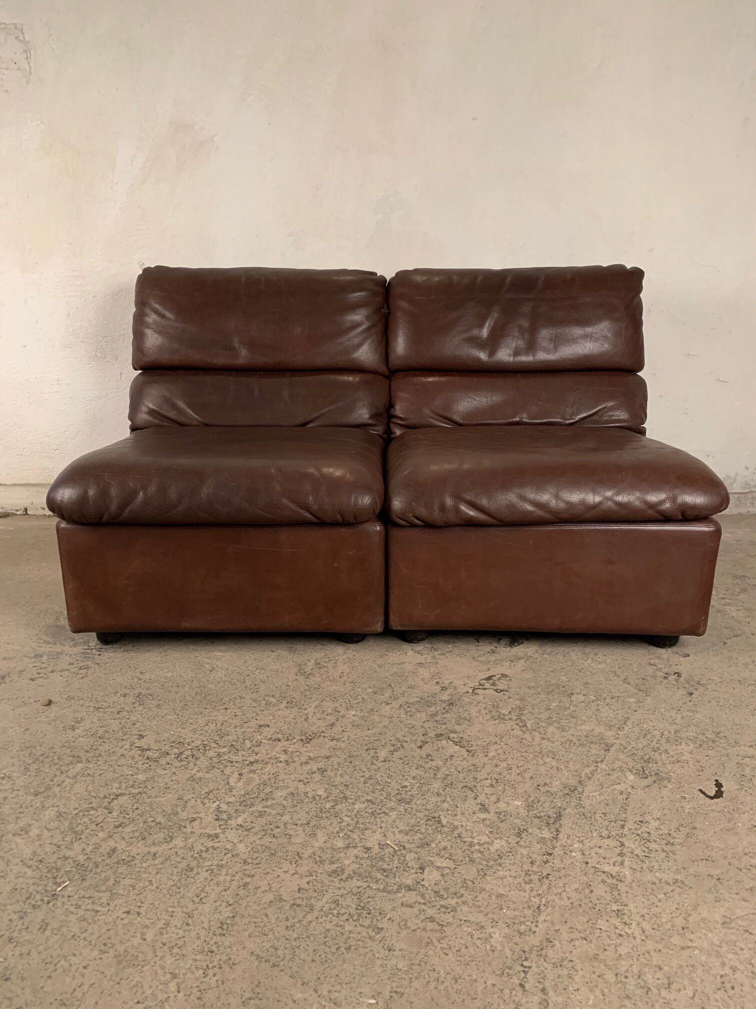 A pair of leather armchairs, Switzerland, 1970s