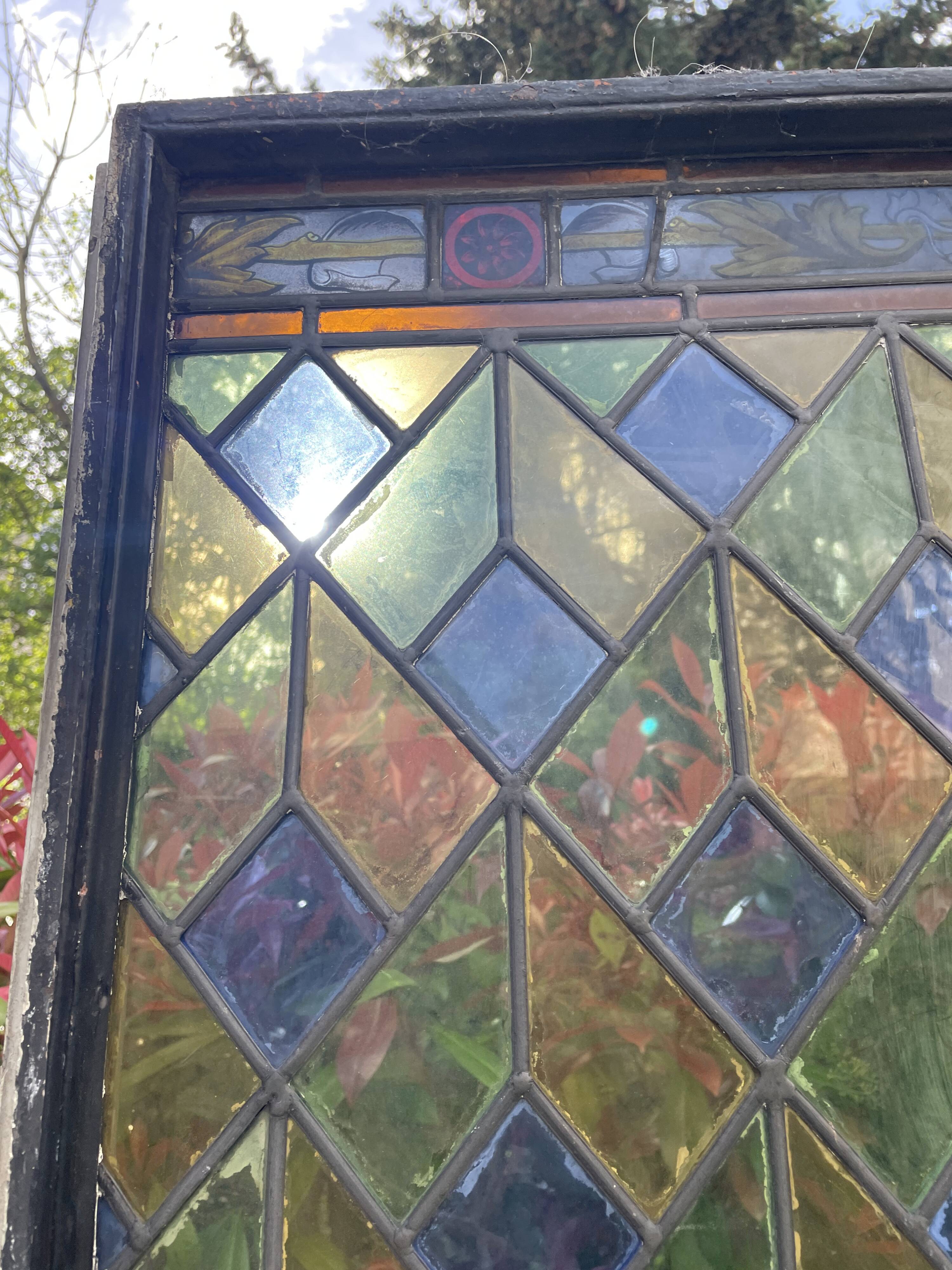 Pair of old double stained glass doors. Metal frames. Stained glass windows