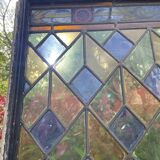 Pair of old double stained glass doors. Metal frames. Stained glass windows