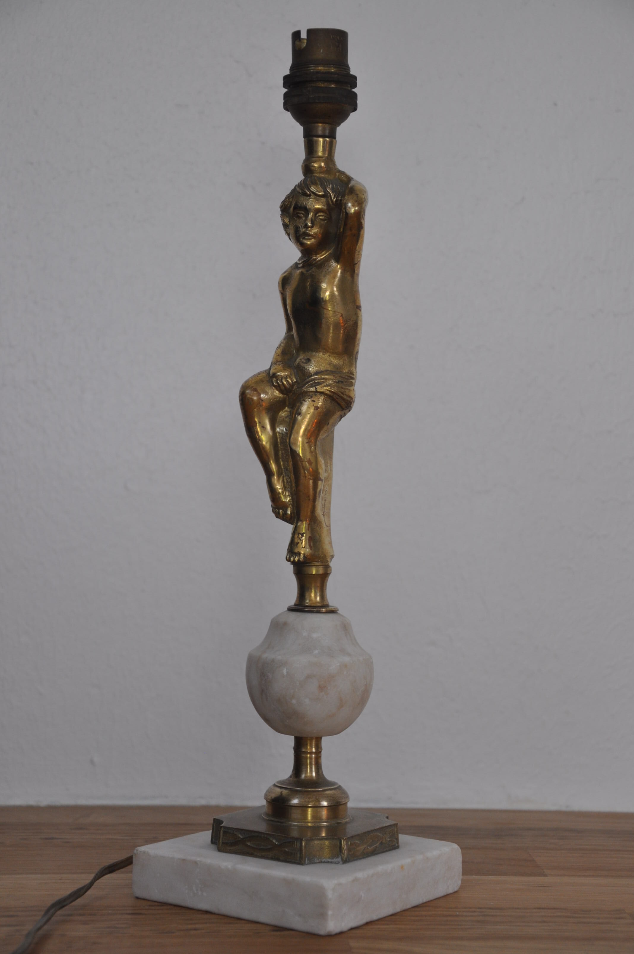 Ancient alabaster lamp and bronze cherub decoration
