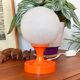 Orange vintage space age eyeball table lamp with a glass globe
