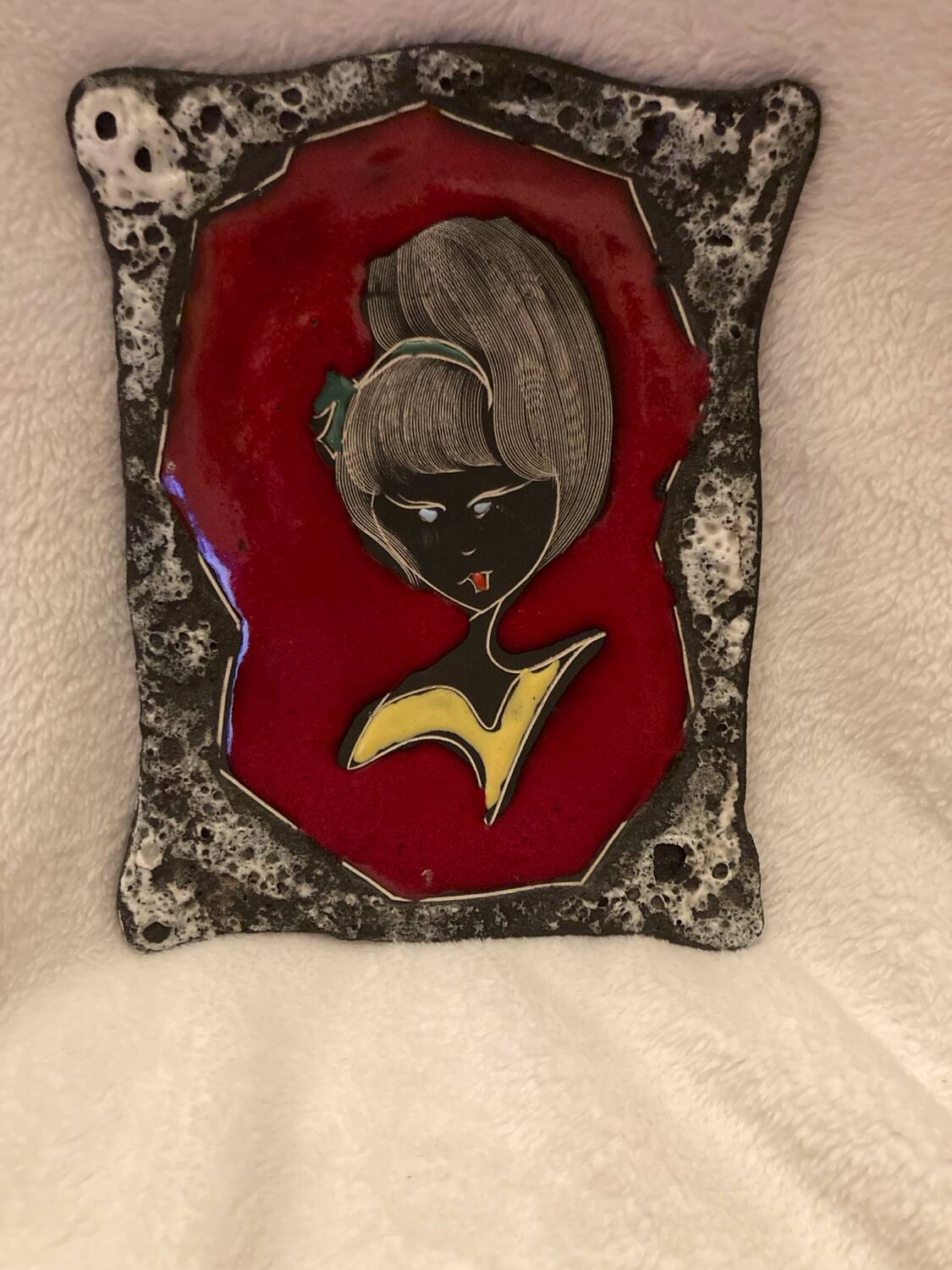 Vintage hanging decorative plate in lava stone