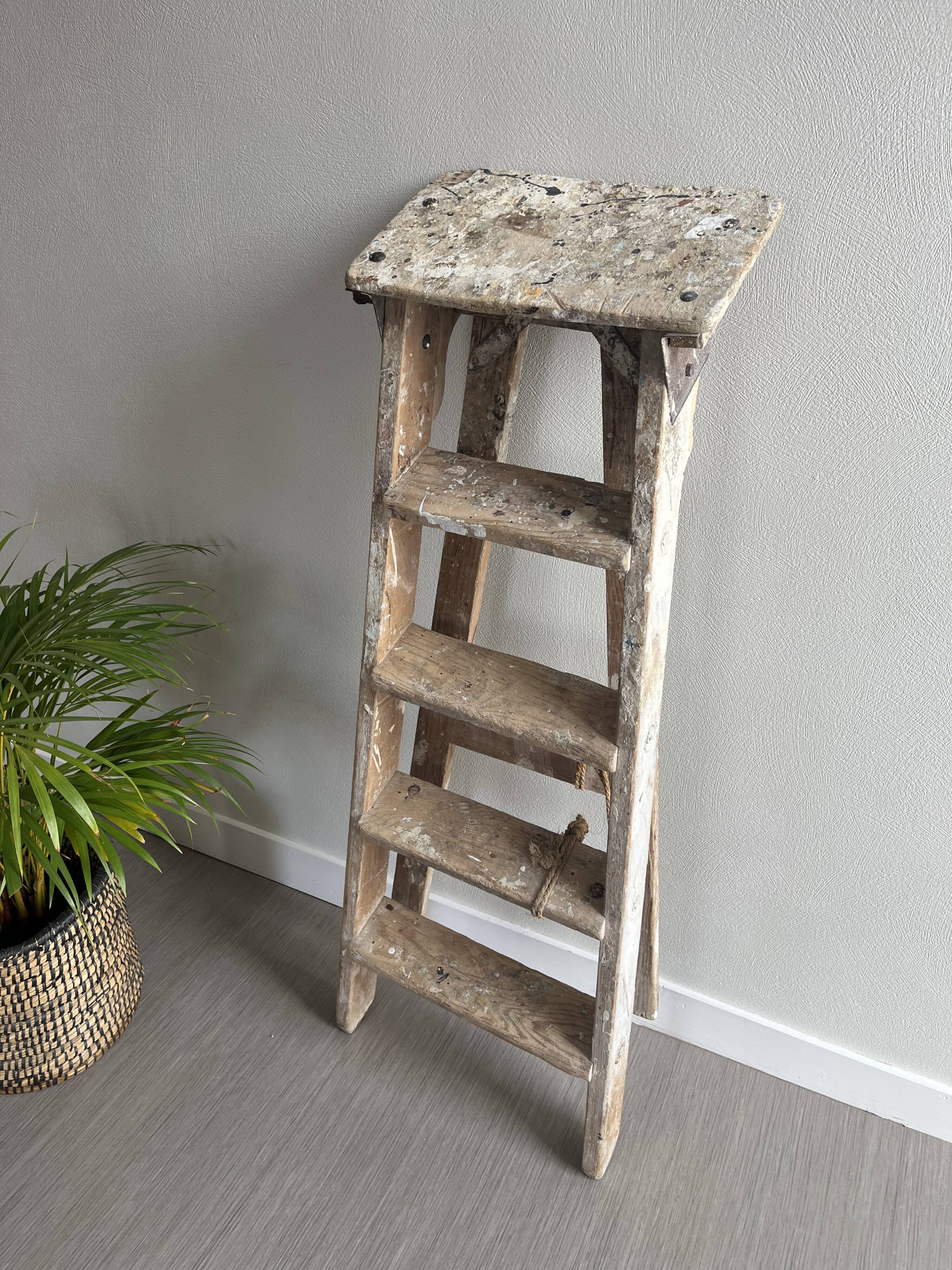 Former stepladder of patinated wood painter