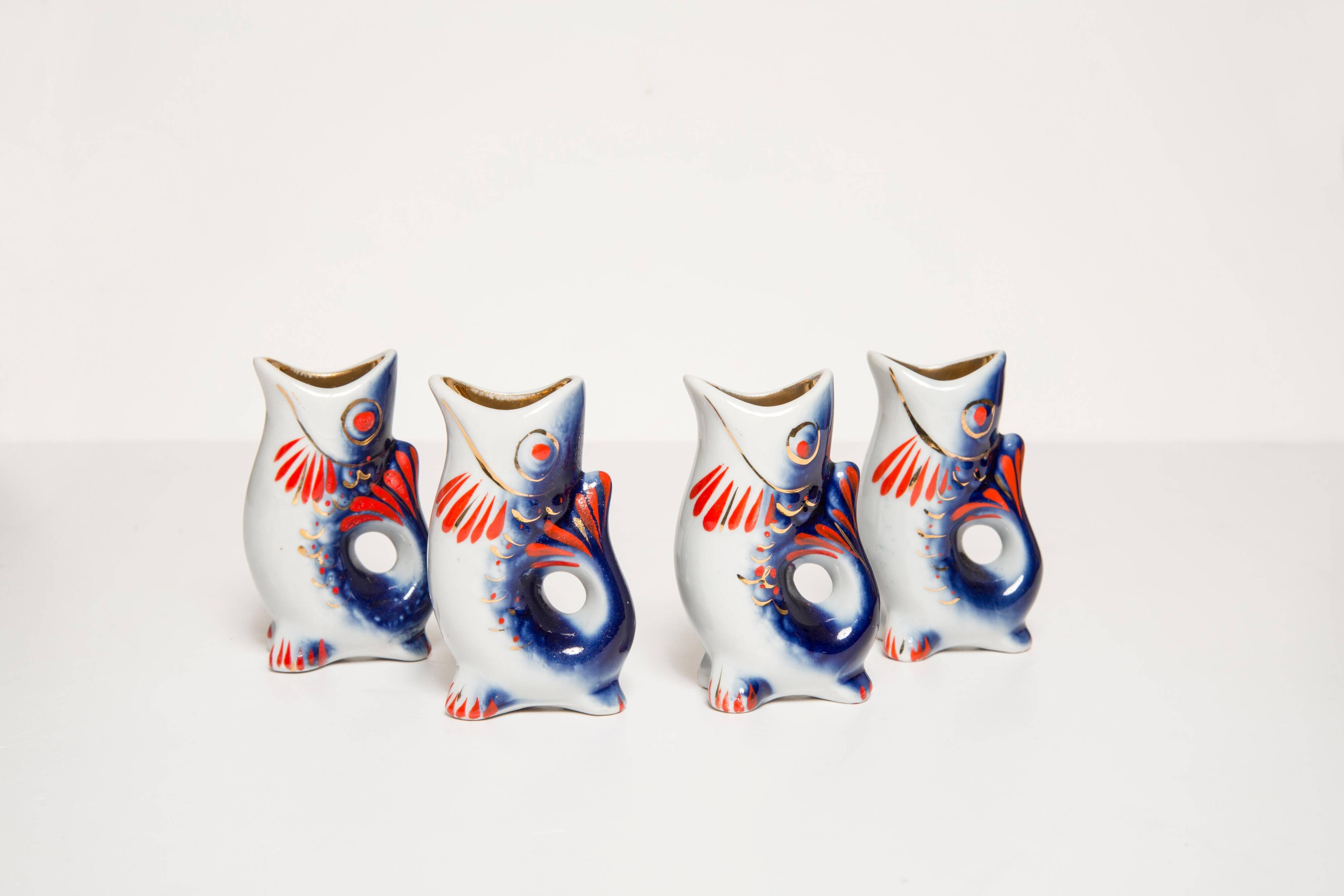 Set of 7 glasses and a glass carafe decorated with blue fish, Mid-Century Modern style, Europe, 1960s.