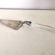 Silver metal pie shovel glass handle Lisa Mori