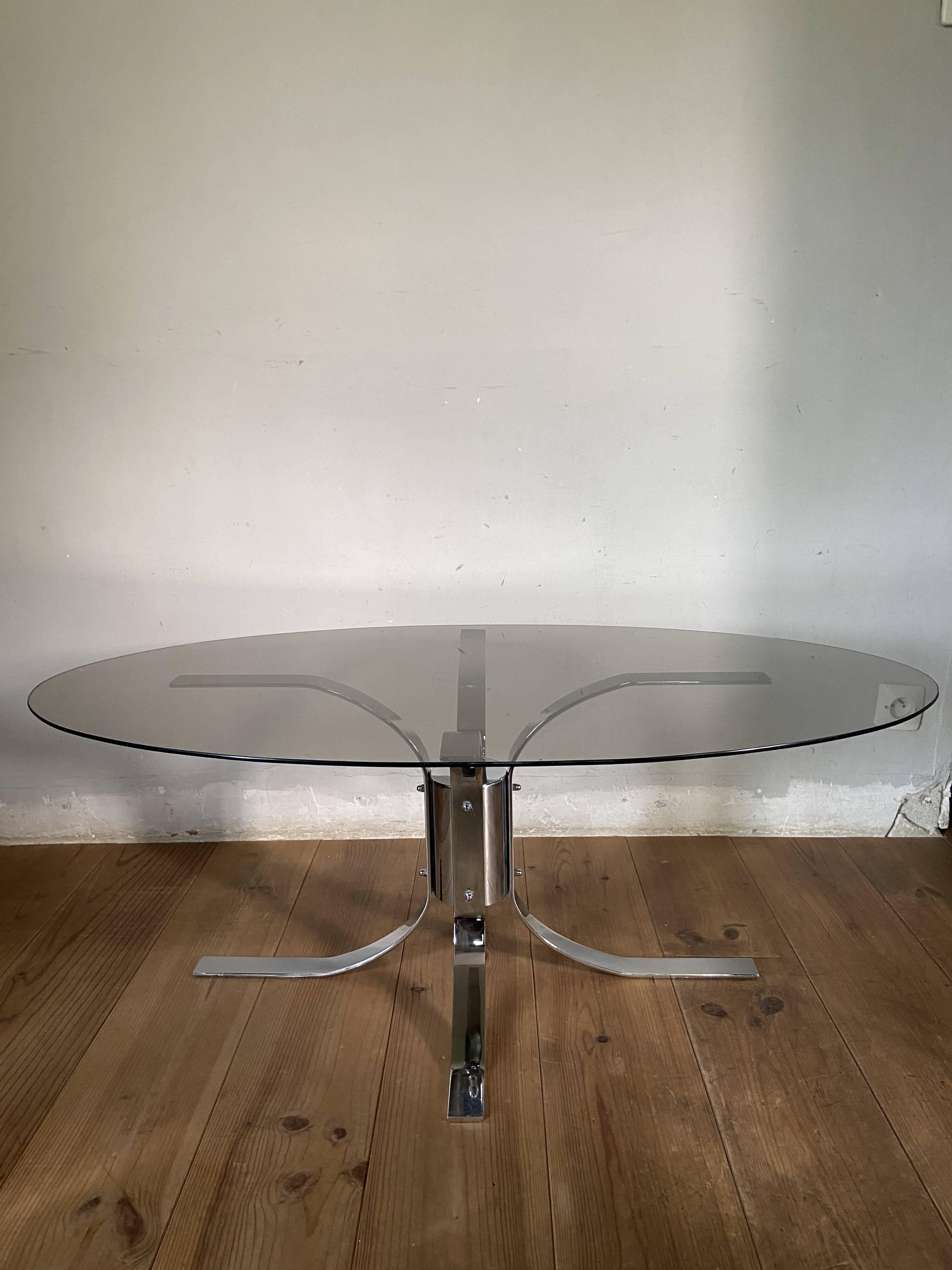 Modernist chrome and smoked glass table with tulip base from the 70s