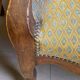 Two Louis XV style wooden and fabric armchairs
