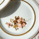 8 Petites assiettes en porcelaine OLYMPIA motif fleuris et dorure
