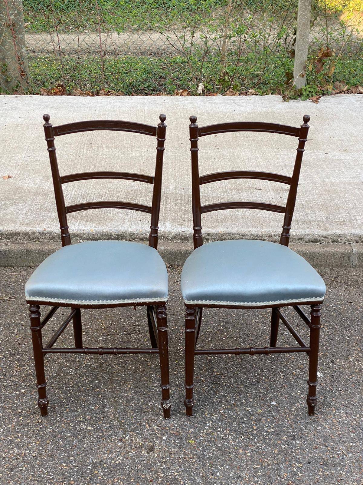 2 Napoleon III chairs in solid wood and blue satin fabric.