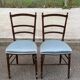 2 Napoleon III chairs in solid wood and blue satin fabric.