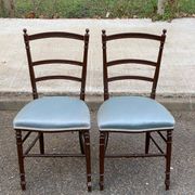 2 Napoleon III chairs in solid wood and blue satin fabric.