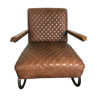 Metal armchair and quilted leather