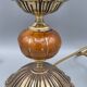 Hollywood Regency bedside lamp in gold metal with a glass globe.