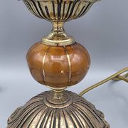 Hollywood Regency bedside lamp in gold metal with a glass globe.