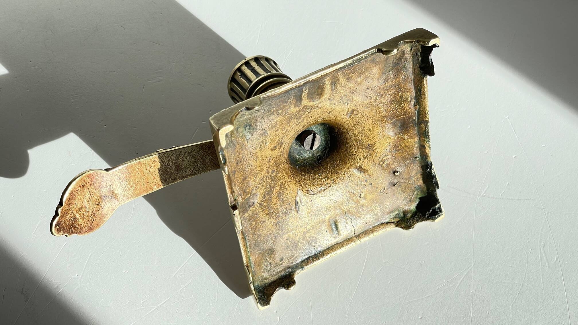 Patterned solid bronze hand candle holder