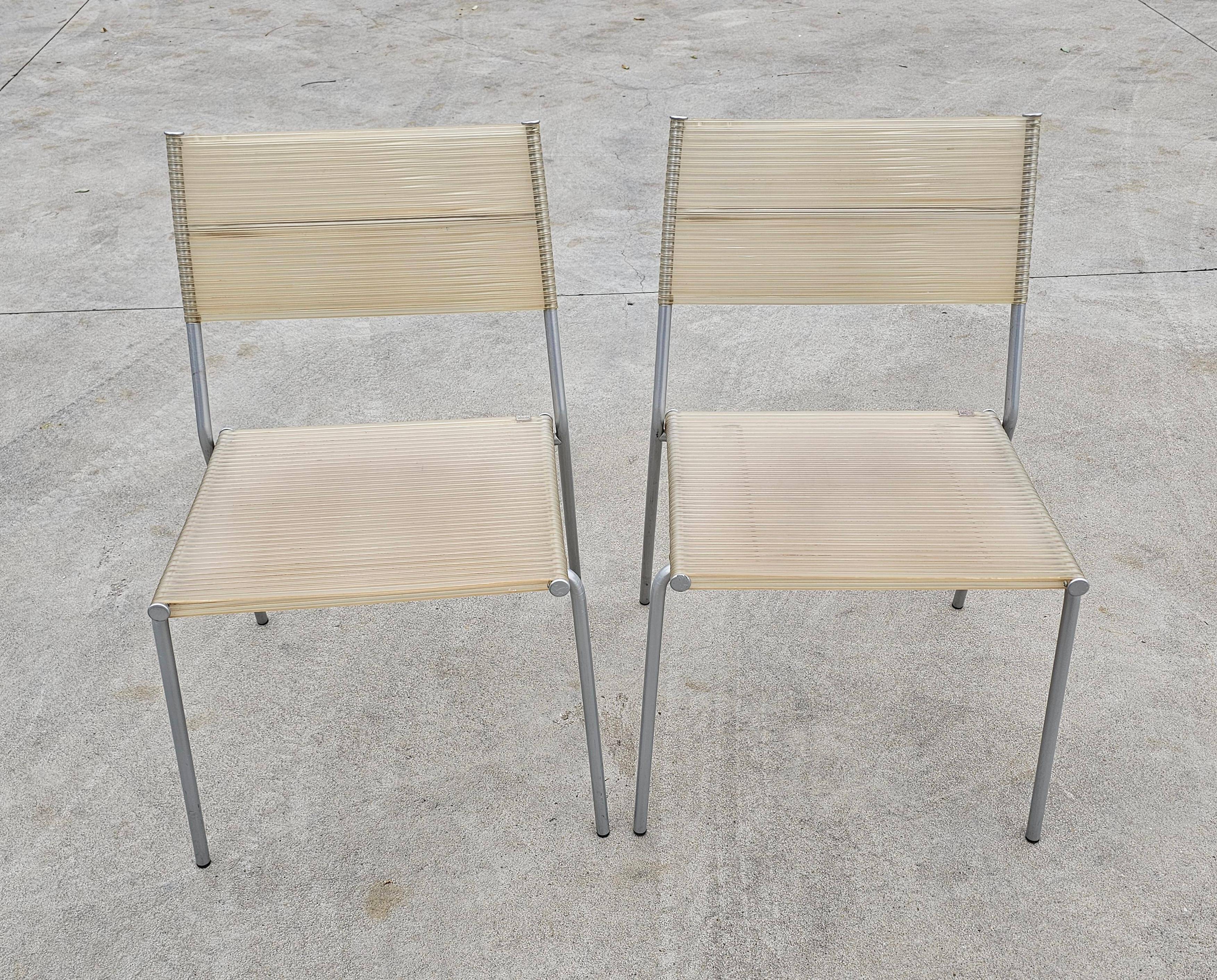 Set of 4 Miss B dining chairs by Tito Agnoli for Bonacina, 1990s.