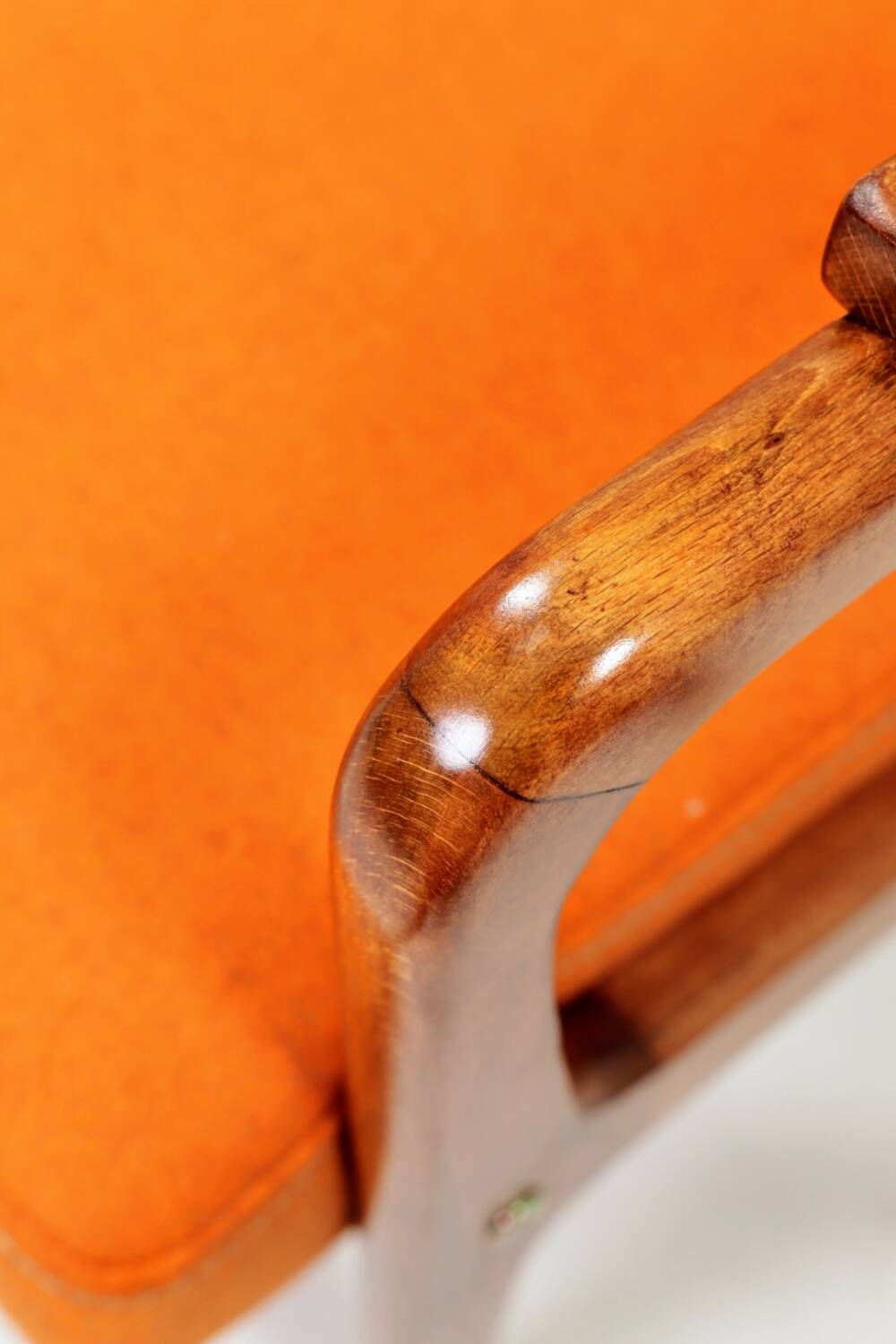 Vintage armchair in papaya orange wool from the 1960s.