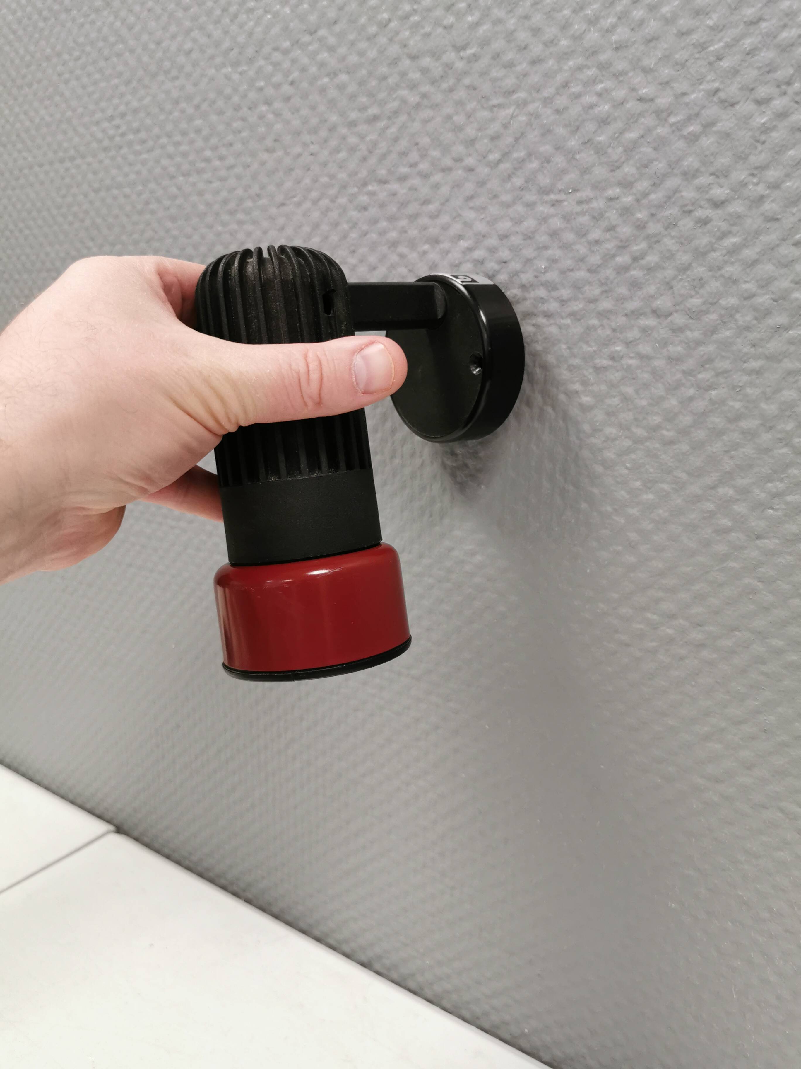 Small vintage wall lamp in hard pressed black and red plastic