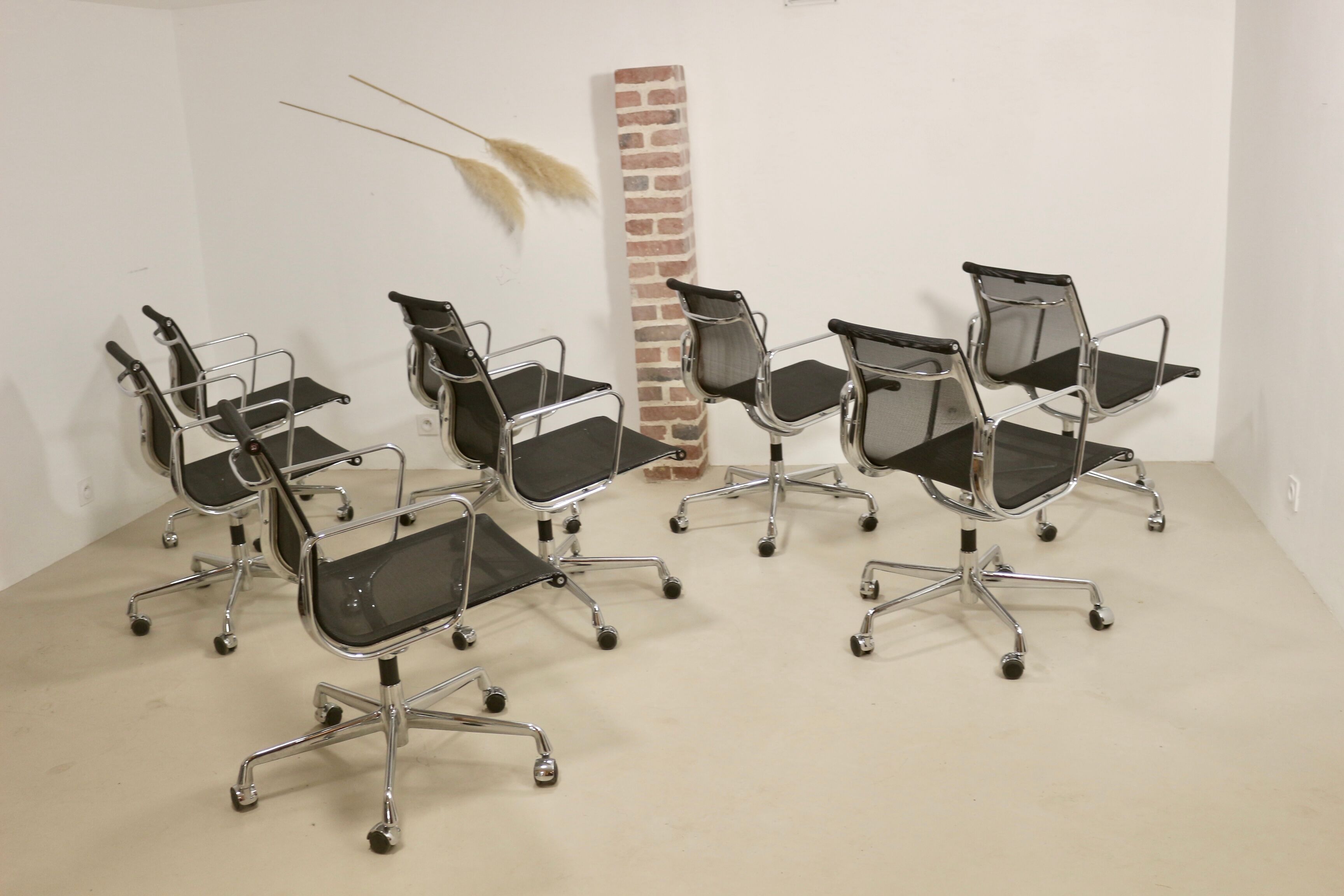 Set of 8 Charles and Ray Eames armchairs by Vitra model EA 117