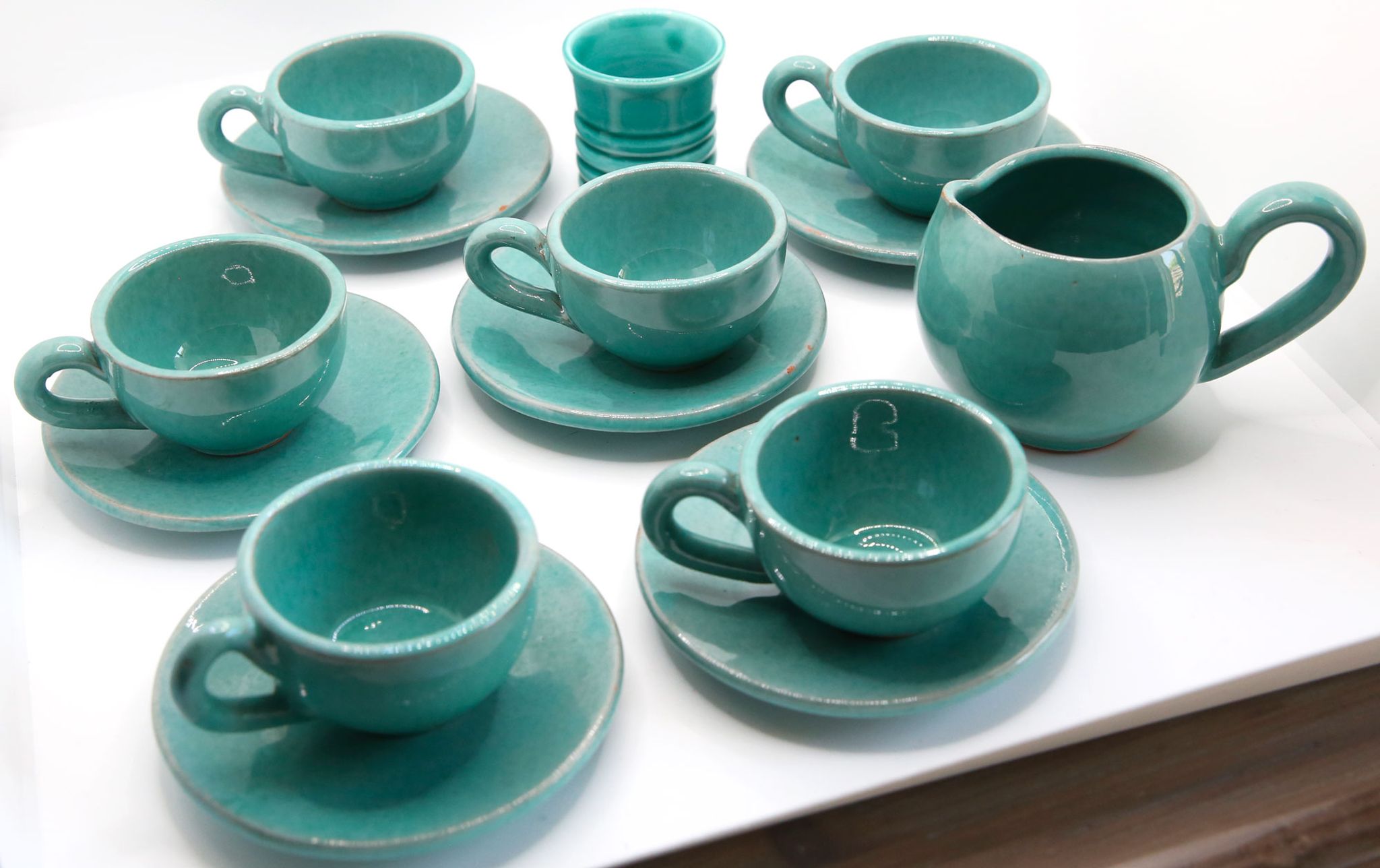 Set of 6 cups in turquoise blue enamelled earth with their saucers and milk jar
