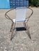 Vintage armchair in black metal and white plastic caning.
