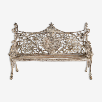 Sculpted cast iron bench and white patina wood