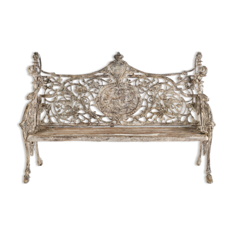 Sculpted cast iron bench and white patina wood