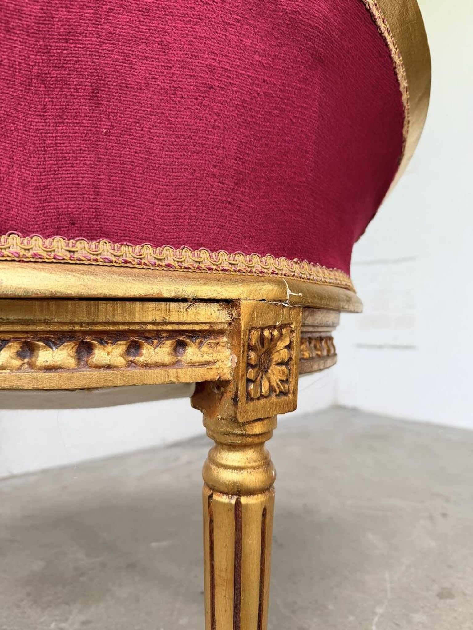 Louis XVI gilt wood and red velvet armchair