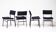 Set of four entirely black Hulmefa dining chairs, Architectural Modernism.