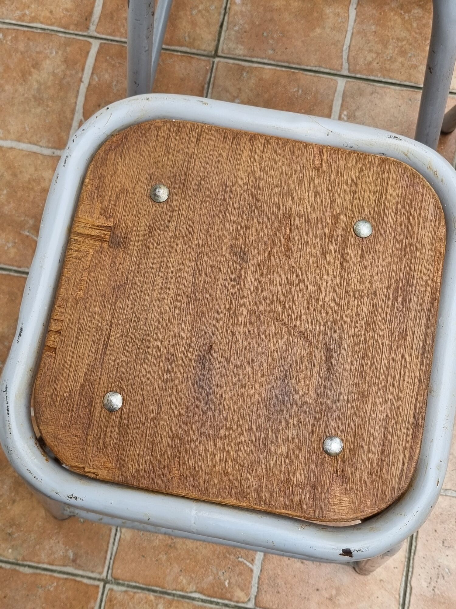 Set of four stackable industrial tubular metal and wood stools
