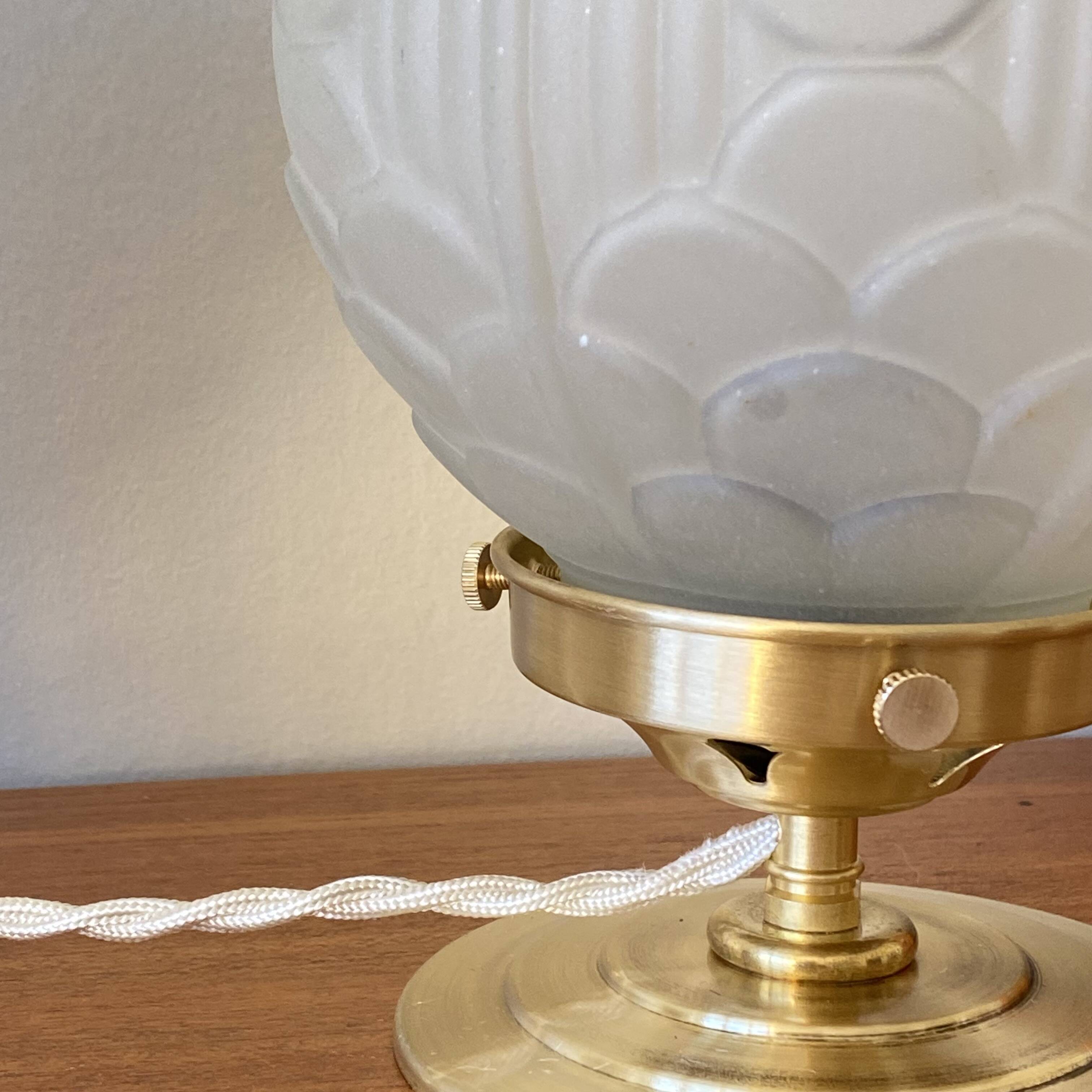 Pair of Art Deco glass globe table lamps with brass base.